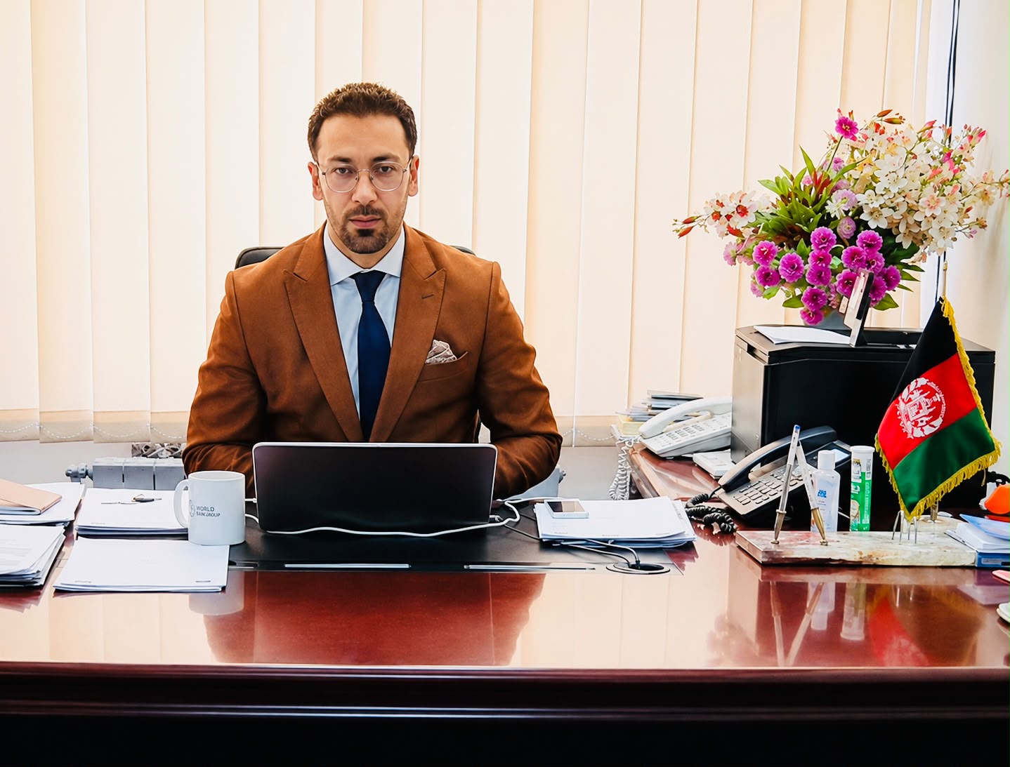Hashmatullah Naebkhil in a professional office setting